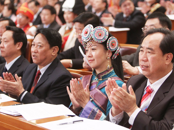 The 11th National People's Congress (NPC), the top legislature of China, starts its third session at the Great Hall of the People in Beijing at 9 a.m. Friday. NPC deputies attend the opening meeting.