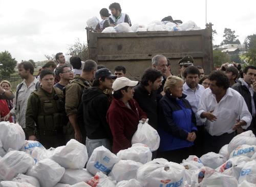 Chilean President Michelle Bachelet visits the humanitarian help center in the quake-devastated Concepcion, Chile, March 4, 2010. It will take at least three years to rebuild the country after the huge quake and tsunami hit Chile on Feb. 27, President Michelle Bachelet said Thursday. [Victor Rojas/Xinhua]