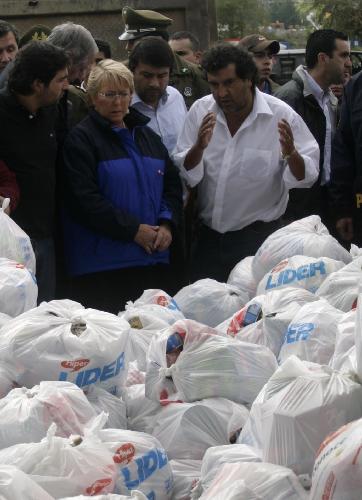 Chilean President Michelle Bachelet visits the humanitarian help center in the quake-devastated Concepcion, Chile, March 4, 2010. It will take at least three years to rebuild the country after the huge quake and tsunami hit Chile on Feb. 27, President Michelle Bachelet said Thursday.[Victor Rojas/Xinhua]