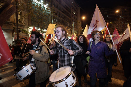 Greek demostrators shout slogans during a protest march against the austerity measures announced by the government in central Athens, capital of Greece, March 4, 2010. The Greek government ruled out on Thursday any possibility of backing off from an austerity plan it announced on Wednesday to fight the deficit, despite a string of protests against the measures. [Marios Lolos/Xinhua]