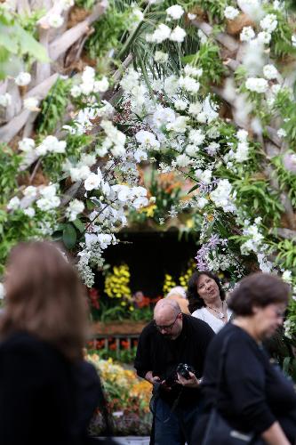 Visitors tour the 8th Annual Orchid show at the Botanical Garden in New York, the United States, March 4, 2010. The exhibition will run till April 11 with some 7,000 orchids on show. [Xinhua]