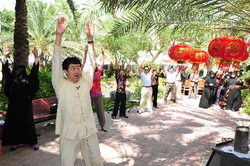  Students learn to play qigong which refers to the type of exercise that manages the health of mind, body and breath during the Chinese Cultural Week at the Zayed University in Abu Dhabi, capital of the United Arab Emirates (UAE), March 3, 2010.