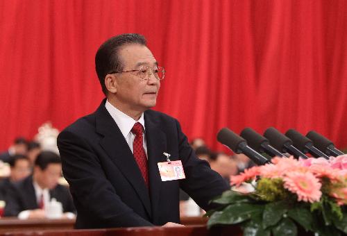 Chinese Premier Wen Jiabao delivers a government work report during the opening meeting of the Third Session of the 11th National People's Congress (NPC) at the Great Hall of the People in Beijing, capital of China, March 5, 2010. [Liu Weibing/Xinhua]
