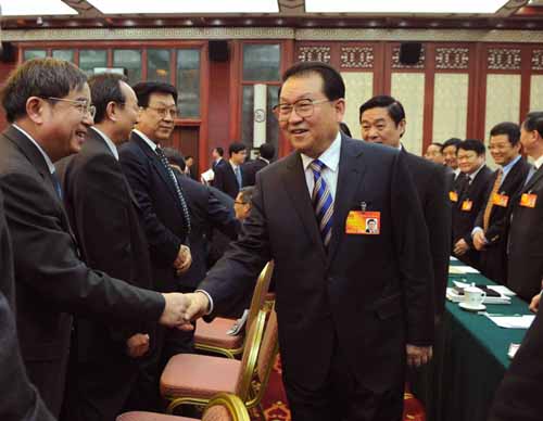 Li Changchun (R, front), member of the Standing Committee of the Political Bureau of the Communist Party of China (CPC) Central Committee, talks with deputies to the Third Session of the 11th National People's Congress (NPC) from southwest China's Sichuan Province, in Beijing, capital of China, March 5, 2010. 