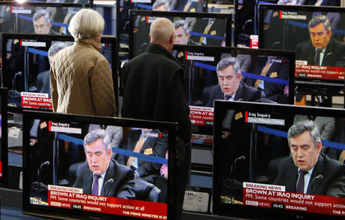 Britain's Prime Minister Gordon Brown is seen on television screens in an electrical store in Edinburgh, Scotland, as he gives evidence to the Iraq Inquiry being held in London March 5, 2010.  (Xinhua/Reuters Photo)
