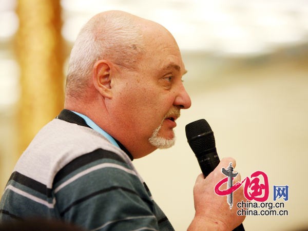 A journalist raises questions for Chinese Foreign Minister Yang Jiechi at a news conference on the sidelines of the Third Session of the 11th National People's Congress (NPC) at the Great Hall of the People in Beijing, China, March 7, 2010.