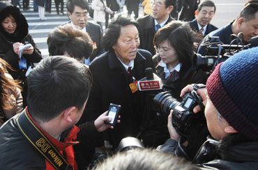 Shen Jilan, China's only person who has been elected as a deputy for all 11 terms of the National People's Congress, answers questions from journalists before the opening of the Third Session of the 11th National People's Congress (NPC) in Beijing, March 5th. [Fan Wenjun / womenofchina.cn] 