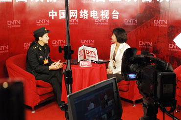 Veteran singer and deputy to the Third Session of the 11th National People's Congress Tan Jing during an interviewed with China Network Television at the Great Hall of the People, March 5th. [Fan Wenjun / womenofchina.cn]