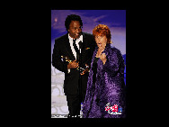 Filmmakers Roger Ross Williams and Elinor Burkett accept Best Documentary Short award for 'Music By Prudence' onstage during the 82nd Annual Academy Awards held at Kodak Theatre on March 7, 2010 in Hollywood, California. [CFP]