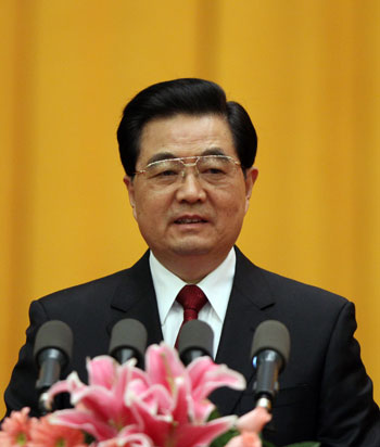 Chinese President Hu Jintao, who is also Genreal Secretary of the Communist Party of China Central Committee and Chairman of Central Military Commission, delivers an important speech at a meeting which marks the 100th anniversary of the International Women's Day at the Great Hall of the People in Beijing, China, March 7, 2010. (Xinhua/Lan Hongguang)