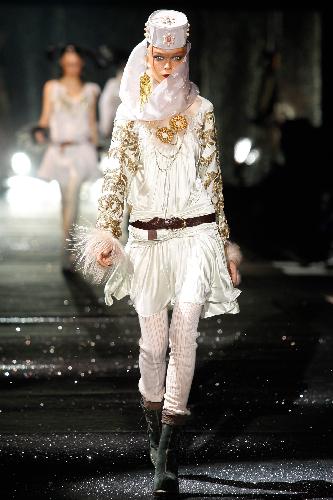 A model wears a creation by British fashion designer John Galliano as part of his ready-to-wear fashion collection 2010, presented in Paris, Sunday March 7, 2010. 