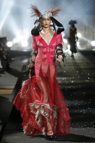 A model displays a creation by British designer John Galliano for