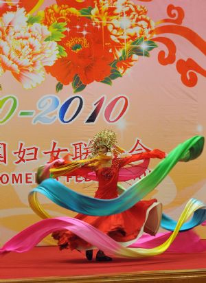 Actor Li Yugang performs during a reception organized by All-China Women's Federation for women from China and abroad to mark the 100th anniversary of the International Women's Day, at the Great Hall of the People in Beijing, capital of China, March 8, 2010. (Xinhua/He Junchang)