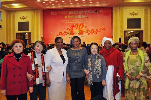 Attendees pose for a photo during a reception organized by All-China Women's Federation for women from China and abroad to mark the 100th anniversary of the International Women's Day, at the Great Hall of the People in Beijing, capital of China, March 8, 2010. (Xinhua/He Junchang)