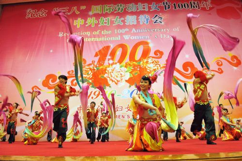 Dancers perform during a reception organized by All-China Women's Federation for women from China and abroad to mark the 100th anniversary of the International Women's Day, at the Great Hall of the People in Beijing, capital of China, March 8, 2010. (Xinhua/He Junchang)