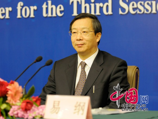 Yi Gang, central bank vice governor and director of the State Administration of Foreign Exchange, answers questions at a press conference on the sidelines of the National People's Congress, the country's top legislature.