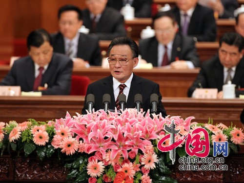Chinese top legislator Wu Bangguo delivers a work report of the Standing Committee of the National People's Congress (NPC), or the top legislative body, at the third session of the 11th NPC Tuesday afternoon. 