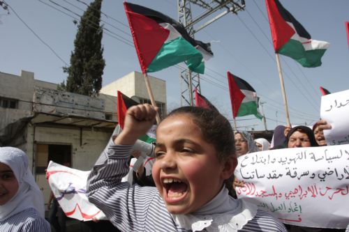Palestinian schoolgirls chant anti-Israel slogans during a demonstration in Rafah, southern Gaza Strip on March 8, 2010. [Khaled Omar/Xinhua]