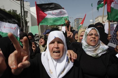 Palestinian women chant anti-Israel slogans during a demonstration in Rafah, southern Gaza Strip on March 8, 2010. [Khaled Omar/Xinhua] 