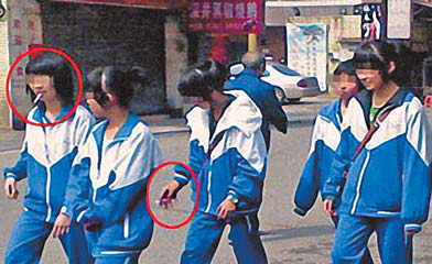 An undated photograph posted recently online shows five schoolgirls smoking on a street in Foshan, Guangdong province. [File Photo: China Daily]