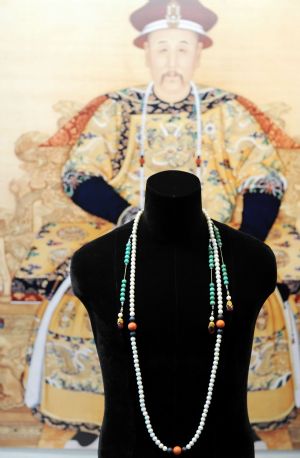 The photo taken on March 9, 2010 shows a ceremonial court pearl necklace made during Qing dynasty (1644-1911), with an estimated value between 8 to 12 million HK dollars, in Hong Kong, south China. 