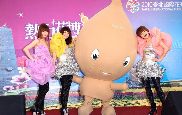 Taiwan gril band, S.H.E. pose with Yabi, the mascot of the 2010 Taipei International Flora Expo, at a press conference in Taipei on March 8. They unveiled the theme song of the flora expo, 'SHERO', at the press conference. They will also be the event's goodwill ambassadors. The flora exposition is due to kick off on Nov 6. 