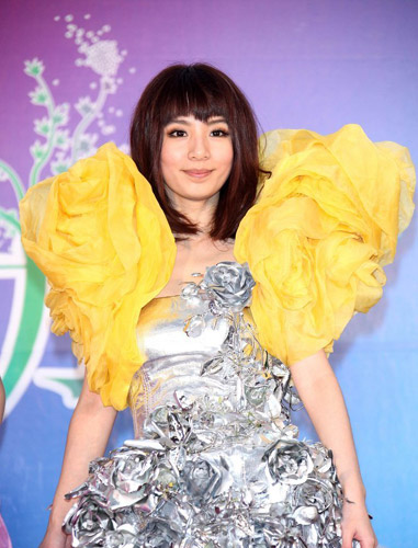 Hebe Tian, a memeber of the Taiwan gril band, S.H.E. poses at a press conference in Taipei on March 8. The band unveiled the theme song for 2010 Taipei International Flora Expo, 'SHERO', at the press conference. They will also be the event's goodwill ambassadors. The flora exposition is due to kick off on Nov 6.