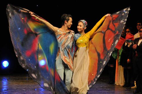 Artists from the China Disabled People's Performing Art Troupe respond to the curtain call at the end of the 'My Dream' show in Amman, Jordan, March 8, 2010. 