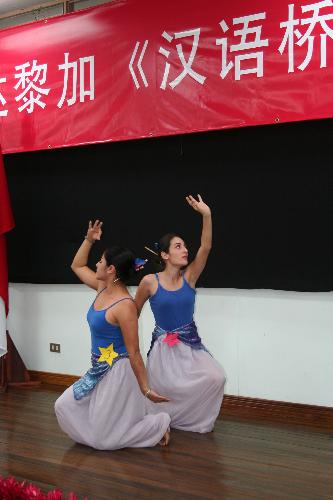 Competitors whose Chinese names are Ren Yue and Zhao Da perform dance during the 'Chinese Bridge' competition in Costa Rican capital of San Jose, March 10, 2010. The preliminary round of the 'Chinese Bridge' competition was held here on Wednesday. [Zhang Yuanpei/Xinhua]