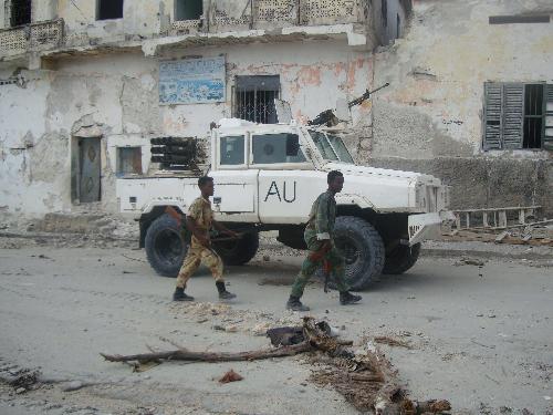 Soldiers of Somali government forces take position at the frontlines of the fighting with Islamist insurgent fighters in Mogadishu, Somali, March 11, 2010. At least 30 people were killed and 83 others injured Thursday as fierce fighting continued between Somali government forces backed by African Union peacekeeping troops and Islamist insurgent fighters in Mogadishu, capital of Somalia