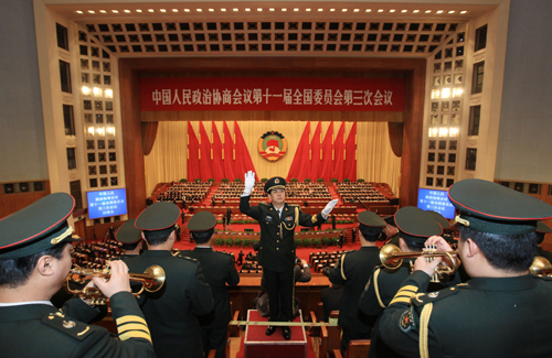 The military band plays during the closing ceremony of the Third Session of the 11th National Committee of the Chinese People's Political Consultative Conference (CPPCC) at the Great Hall of the People in Beijing, capital of China, March 13, 2010. (Xinhua/Pang Xinglei)
