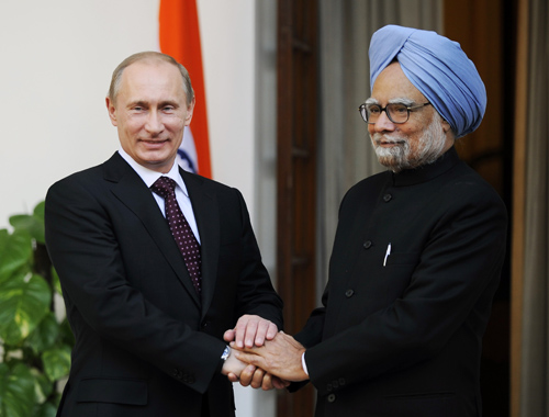 Indian Prime Minister Manmohan Singh (R) shakes hands with Russian Prime Minister Vladimir Putin at Hyderabad House in New Delhi, capital of India, March 12, 2010.[Stringer/Xinhua] 