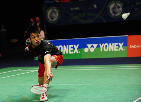 Lin Dan suffered quarterfinal exit at the 100th All England Open Badminton Championship on Friday as the Chinese top player was edged out by teammate Bao Chunlai in three games. [Zeng Yi/Xinhua]
