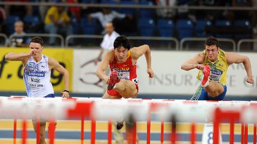 China's Liu Xiang (C) competes in the men's first round 60m hurdles at the 2010 IAAF World Indoor Athletics Championships in Doha, capital of Qatar, on March 12, 2010. [Chen Shaojin/Xinhua]