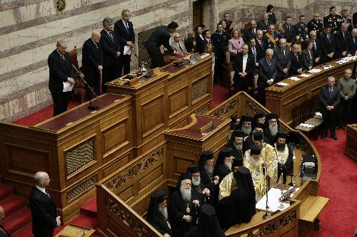 Karolos Papoulias (2nd L, above) is sworn in for a second term as president of the Greek Republic in Athens, capital of Greece, March 12, 2010. He called on all Greeks to jointly deal with the cash-strapped country's economic woes. Papoulias won a second five-year term after capturing 266 votes in the 300-member parliament in an election on Feb. 3. [Marios Lolos/Xinhua]