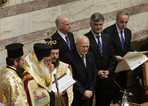 Karolos Papoulias (3rd R) is sworn in for a second term as president of the Greek Republic in Athens, capital of Greece, March 12, 2010. [Marios Lolos/Xinhua]