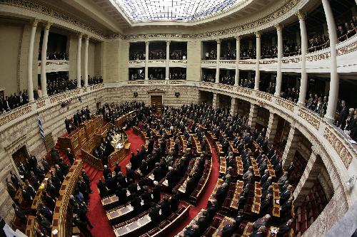 The swear-in ceremony of Greek President Karolos Papoulias is held in parliament in Athens, capital of Greece, March 12, 2010. Karolos Papoulias was sworn in Friday for a second term as president of the Greek Republic and called on all Greeks to jointly deal with the cash-strapped country's economic woes. Papoulias won a second five-year term after capturing 266 votes in the 300-member parliament in an election on Feb. 3. [Marios Lolos/Xinhua]