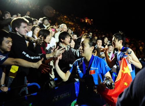 Zhang Nan (1st R) and Zhao Yunlei of China celebrate after the mixed doubles final of 2010 All England Open Badminton Championships in Birmingham, Britain, March 14, 2010. Zhang and Zhao defeated Nova Widianto and Liliyana Natsir of Indonesia by 2-1. (Xinhua/Zeng Yi) 