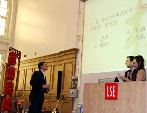 A contestant answers cultural knowledge questions during the British leg of the ninth 'Chinese Bridge' world university students' Chinese lauguage competition at the London School of Economics in London, capital of Britain, March 13, 2010. A total of 20 competitors from 12 universities and the Confucius Institute took part in the competition here on Saturday. [Kang Yi/Xinhua]