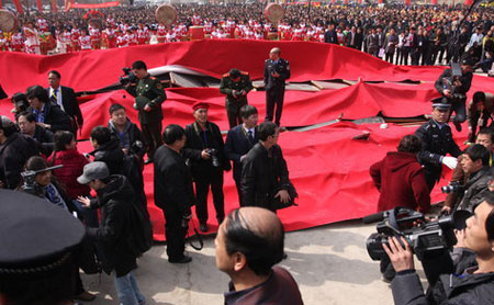Police arrive at the launch ceremony of 'Zhao's Orphan' after a platform collapse injured several journalists on in Yangquan, Shanxi Province, on Saturday, February 13, 2010. 