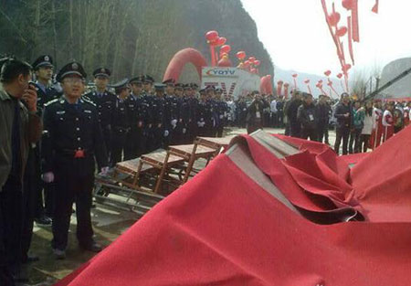 Police arrive at the launch ceremony of 'Zhao's Orphan' after a platform collapse injured several journalists on in Yangquan, Shanxi Province, on Saturday, February 13, 2010. 