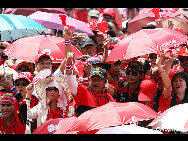 Anti government 'Red Shirts' arriving in Bangkok from the North and Northeast of Thailand on March 13, 2010 to hold demonstration to force the current government to resign and call new elections or face weeks of continued disruptions in Bangkok. [chinanews.com.cn]