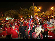 Anti government 'Red Shirts' arriving in Bangkok from the North and Northeast of Thailand on March 13, 2010 to hold demonstration to force the current government to resign and call new elections or face weeks of continued disruptions in Bangkok. [chinanews.com.cn]