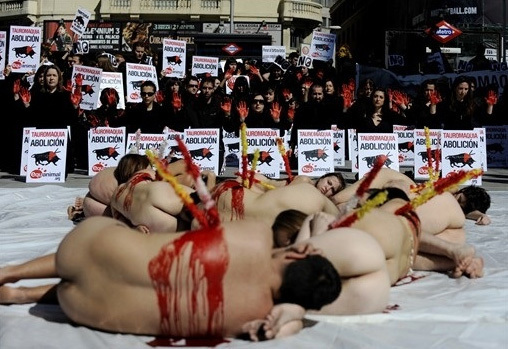 Animals rights activists covered in fake blood protest during a demonstration calling for the abolition of bullfights in Valencia March 14, 2010.[CRIOnline.com]