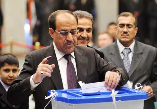 File photo shows Iraqi Prime Minister Nuri al-Maliki casts his ballot at a polling station in Baghdad, capital of Iraq, on March 7, 2010.  (Xinhua File Photo)