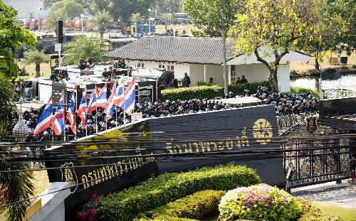 Soldiers guard inside the base of Thai Army 11th Infantry Regiment in Bangkok, capital of Thailand, March 15, 2010. Thousands of protesters on Monday rallied outside the base where the premier Abhisit Vejjajiva had his crisis headquarters to call on him dissolve the parliament, but Abhisit refused.[Lui Siu Wai/Xinhua]