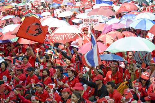 Members of &apos;red-shirts&apos;, supporters of the United Front for Democracy against Dictatorship (UDD), hold a rally in Bangkok, capital of Thailand, March 14, 2010. (Xinhua/Lui Siu Wai)