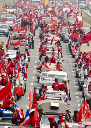 Members of &apos;red-shirts&apos;, supporters of the United Front for Democracy against Dictatorship (UDD), travel to Bangkok, capital of Thailand, March 13, 2010. The demonstration organized by the UDD started on Friday when the red-shirted supporters of fugitive former Prime Minister Thaksin Shinawatra are traveling to Bangkok. [Lui Siu Wai/Xinhua]