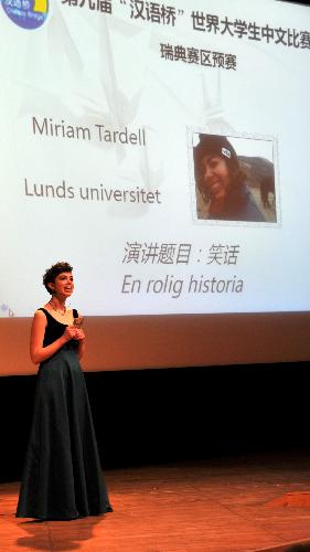 A student from Lund University narrates and shows her talent during the second 'Chinese Bridge' Chinese language competition of Swedish middle school and university students in Stockholm, capital of Sweden, March 14, 2010. Nine university students and 33 middle school students took part in the competition on Sunday. [He Miao/Xinhua]