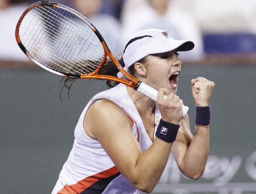 Alisa Kleybanova of Russia celebrateds after her victory over Kim Clijsters of Belgium during their match at the Indian Wells WTA tennis tournament in Indian Wells, California, March 15, 2010. Kleybanova won 2-1. (Xinhua/Reuters Photo)